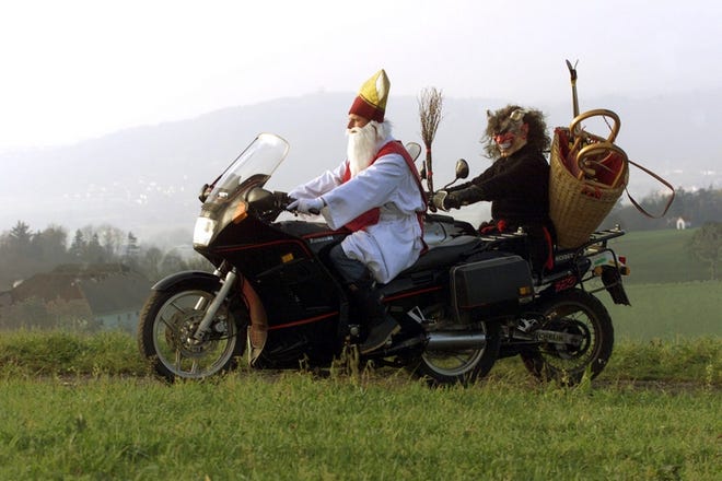 St. Nicholas and his devilish sidekick, Krampus, ride to an event as part of pre-Christmas celebrations in the province of Upper Austria. Opposition to visits by St. Nicholas to Vienna's kindergartens by city officials is creating an uproar in Austria.