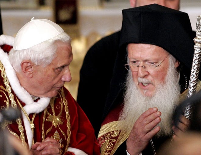 Pope Benedict XVI listens to the Ecumenical Orthodox Patriarch Bartholomew I at the Patriarchal Cathedral of St. George at the Orthodox Patriarchate in Istanbul, Turkey, Wednesday, Nov. 29, 2006. The pope's visit to Turkey was born out of Benedict's desire to meet Bartholomew, who has his headquarters in Istanbul, once ancient Constantinople. The pontiff has been trying to foster better relations between the Orthodox and Catholics. (AP Photo/Murad Sezer)
