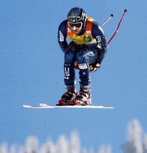 U.S. racer Bode Miller, of Easton, N.H., takes to the air as he skis to a best time in the men's downhill race in the men's World Cup Combined race at Beaver Creek, Colo., on Thursday, Nov. 29, 2006. (AP Photo/Alessandro Trovati)