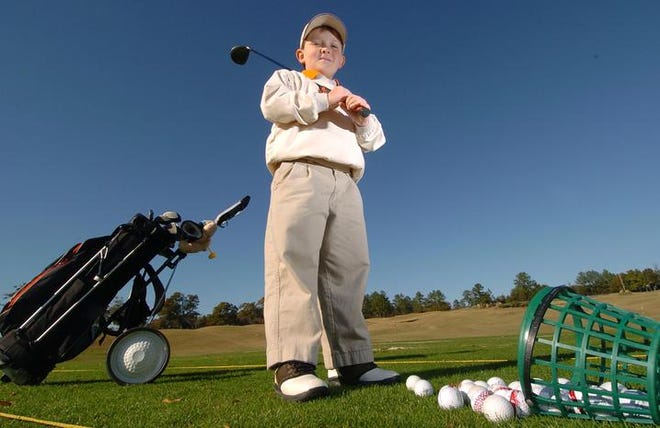 Alex Shead takes a break during a practice session at the First Tee of Augusta. Shead, of Appling, recently won the 8-year-old division of the U.S. Kids Golf Atlanta Fall Tour, earning a spot in the U.S. Kids Golf World Championships in Pinehurst, N.C.
