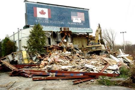 The structure that housed the Danish Health Club in Kittery, Maine, is demolished Wednesday by HL Patten Construction Inc. to make room for condominiums. The Danish Health Club was closed after a raid in 2004 by FBI and IRS agents and later proven to be a prostitution establishment.