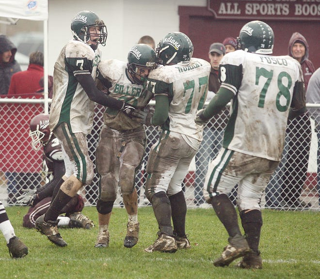 Members of the Billerica High football team celebrate a score during the wild Thanksgiving Day loss to Chelmsford.