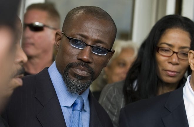 Actor Wesley Snipes and his attorneys face the media at the Federal Courthouse in Ocala. Snipes returned from making a movie in Africa to face the tax evasion charges.
