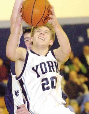 York's Zach Prugar drives to the basket during the Wildcats? 59-53 win over Yarmouth on Friday.
