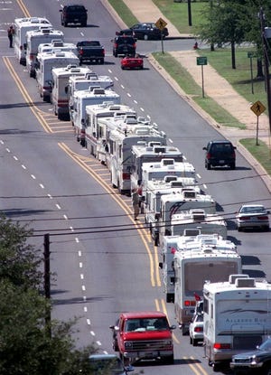 Campers and RVs travel on Paul W. Bryant Boulevard toward the large parking lot beside Coleman Coliseum in September 1999 before the Alabama-Arkansas game.