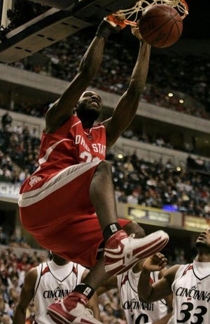 Ohio State's Greg Oden dunks against Cincinnati. The freshman's play led to an easy win Saturday in his hometown of Indianapolis.