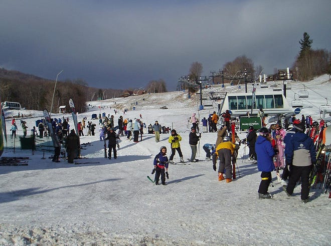 Skiers and riders enjoy a recent Saturday at the slopes at Okemo Mountain Resort in Ludlow, Vt.