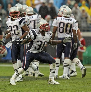 James Sanders celebrates the fumble recovery by Rodney Harrison at the end of the game as the New England Patriots defeated the Jacksonville Jaguars on Sunday.