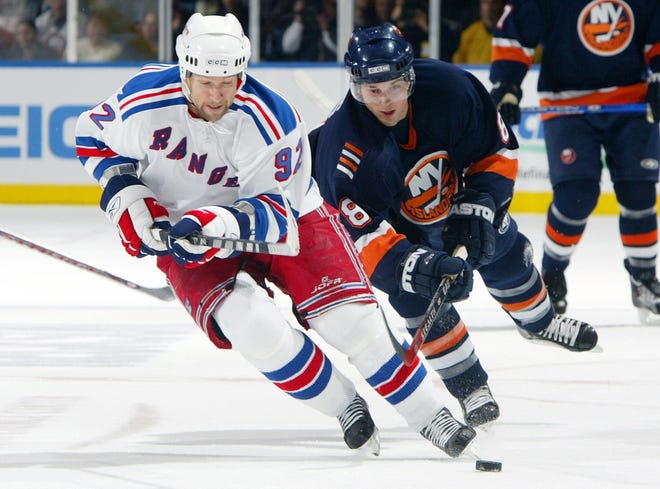 UNIONDALE, NY - DECEMBER 26: Bruno Gervais #8 of the New York Islanders pursues Michael Nylander #92 of the New York Rangers December 26, 2006 at the Nassau Coliseum in Uniondale, New York. (Photo by Jim McIsaac/Getty Images)