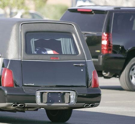 The remains of former President Gerald R. Ford arrive at St. Margaret's Episcopal Church for funeral services Friday, Dec. 29, 2006 in Palm Desert, Calif. Ford died Tuesday at his home in Rancho Mirage, Calif. He was 93. (AP Photo/Chris Carlson)