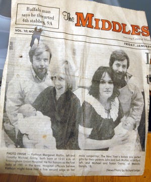 The original newspaper clipping from 1981 shows Katie Mullin with her parents, left, at Framingham Union Hospital, along with the Garry family of Medway, right.