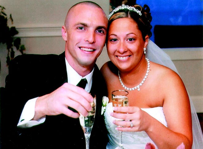 Jennifer Bent of Bellingham and Sean Roddy of Franklin enjoy a glass of champagne on their wedding day May 20, 2006. The ceremony was held at St. Mary's in Franklin.