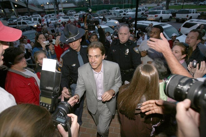 Former Miami Dolphins coach Nick Saban is welcomed to the University of Alabama on Wednesday after accepting an offer to become the school's head football coach.