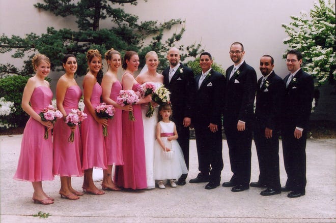 Amy Sporer, of Southborough, and Aaron Gonzalez, of Clinton, center, stand with their wedding party after their May 20, 2006, wedding at the Radisson Hotel in Milford. From left are: Bridesmaids Sam Hopta of Milford, N.J.; Nasim Pahlavan, of Virginia; Laura Gonzalez, of Worcester; Anita Bernyk, of Hull; Karyn Sporer, of Framingham; flower girl Taylor Foley, of Grafton; Groomsmen: T. Brown of Carlisle, Pa.; Ryan Gonzalez, of Minneapolis, Minn.; Charlie Gonzalez, of New Albany, Ind.; and Seth Errington, of Grafton.
