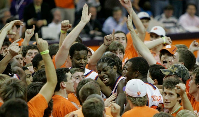 Clemson fans surround James Mays, center, after he made the winning shot to defeat Georgia Tech 75-74 Saturday. (AP Photo/Mary Ann Chastain)