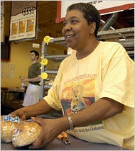 Rose McDaniels working at the Great Harvest Bread bakery in Jackson, Miss. She spends more than 10 percent of her income on insulin.