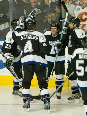 Tampa Bay's Vincent Lecavalier (4) had two goals and an assist and, here, celebrates with Martin St. Louis during a third-period goal that led to a Lightning victory over the Washington Capitals on Thursday night.