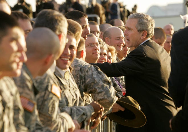 President Bush shakes hands with troops as he leaves Fort Benning, Ga. Thursday, Jan. 11, 2007. (AP Photo/Gerald Herbert)