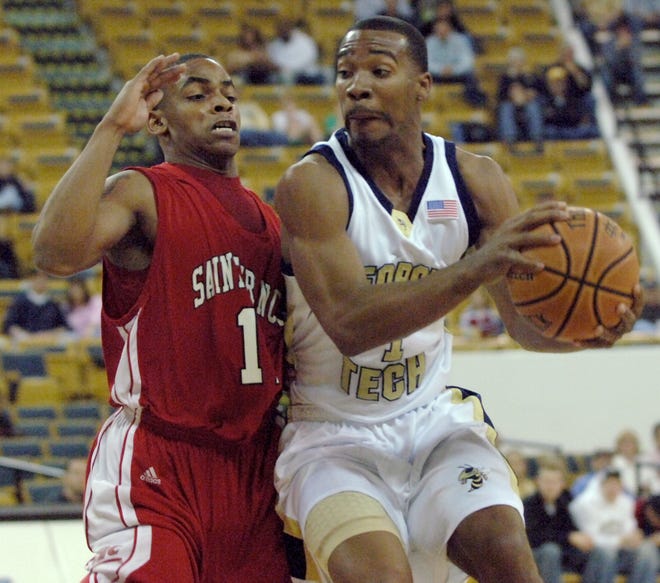 Georgia Tech guard Javaris Crittenton, right, drives against Saint Francis guard Marquis Ford during the first half of a basketball game Saturday, Dec. 30, 2006, in Atlanta. (AP Photo/Gregory Smith)