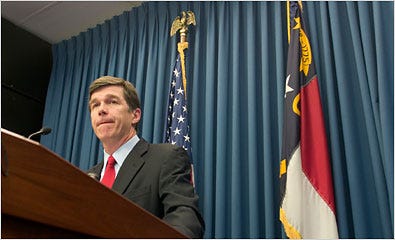 Roy A. Cooper, the attorney general, at a news conference Saturday.