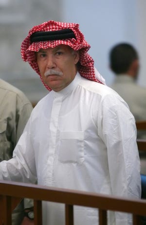 Barzan Ibrahim, half brother of Iraqi President Saddam Hussein, reacts after being sentenced to death on Nov. 5, 2006.
