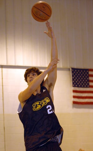 Savannah College of Art and Design guard/forward Nick Maloy finger rolls a hook shot during practice.