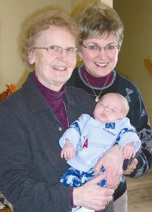 Sister Marion Reiersen, left, and Pat Stys, co-founders of Shepherd’s Maternity House in Price Township, with baby Eric, have provided a supportive haven for first-time unwed mothers. With the anniversary of the landmark Roe v. Wade Supreme Court ruling on Monday that allows abortion, the Community News writer profiles the alternative 
 home for women who want to choose life for their babies.