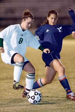Kayla Grimsley, left, of George Jenkins gains control of the ball against Lake Howell's Janisse Guzman in Thursday night's game.
