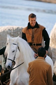 This photo supplied by Disney Parks shows soccer star David Beckham portraying the gallant Prince Phillip from Disney's Sleeping Beauty,sitting astride a horse during a photo shoot on place Dec. 18, 2006 in Burguillo Lake, Spain, near Madrid. Photographer Annie Leibovitz was commissioned for three images to kick off Disney Park's Year of a Million Dreams celebration. The Disney Parks project is his first endorsement since signing a contract to play professional soccer in the United States. Each of Leibovitz's three Dream-themed images feature a scene, with celebrities - including Beckham, Beyonce and Scarlett Johansson - playing the role of a fabled Disney character. The celebration's promotion was unveiled on Friday.