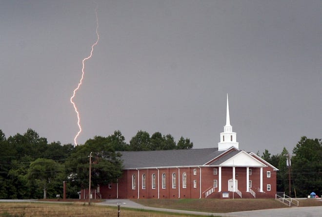 A lightning bolt hits the ground behind the Mt. Olive Baptist Church off

Highway 110 in this file photo.