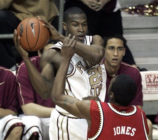 Florida State's Jason Rich looks to pass against Maryland's Mike Jones during the second half of Tuesday's game in Tallahassee. The Seminoles won, 96-79.
