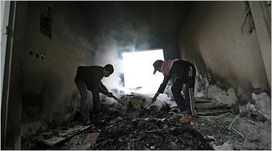 Palestinian youths playing in a damaged building used as a base by Fatah loyalists. As fighting continues, few Gazans venture outside.