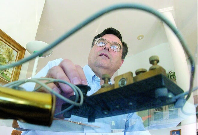 Bill Morine (CQ) of Wilmington, sends a message using morse code over the Ham radio to another operator in Waynesboro, Va Tuesday February 6, 2007. Morse code is being eliminated from the amateur radio operator licensing test. Staff Photo By JEFFREY S. OTTO / WILMINGTON STAR NEWS
