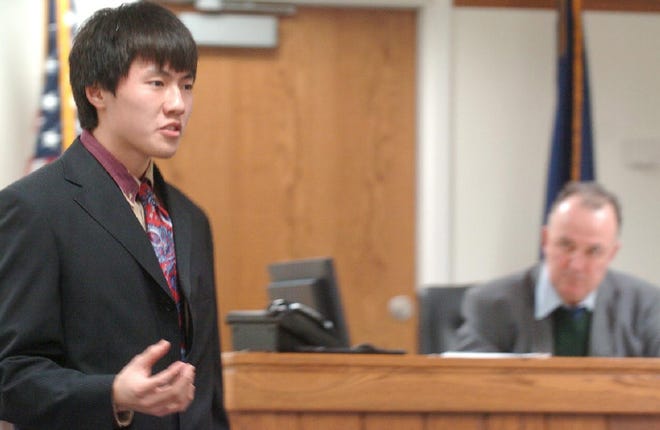 Tony Jiang, defense attorney for Stroudsburg High School Team 2, gives his closing argument as attorney Paul Kramer, playing the role of judge, presides during the Pa. Mock Trial Competition at Monroe County Courthouse on Monday.