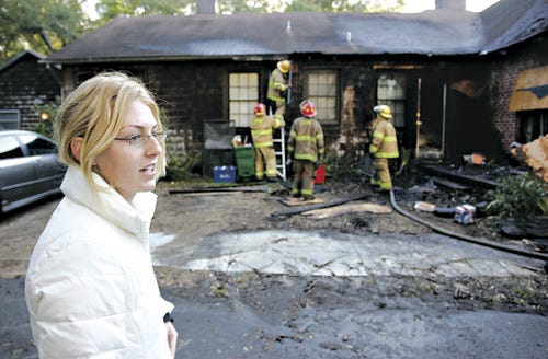 Kelly Sachs, 21, is credited with saving the lives of at least four people involved in an early morning house fire Tuesday at 1406 NW 5th Ave.