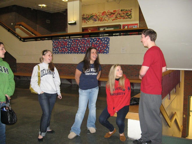 Westborough High School grads Jordan Lavin, Nikki Valletta and Danielle Siegel talk with senior Brendan Huddy about college during a visit to the school in January. The graduates were invited by the school’s Guidance Department to talk about their experiences in college.