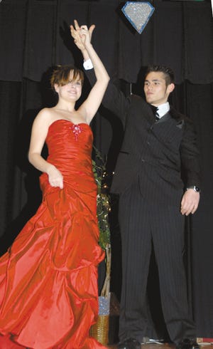 Kaitlen MIller models a prom dress with Joe Prijdekker at the Diamonds are Forever Fashion Show at Middle Smithfield Elementary School. The show was produced by East Stroudsburg High School-North students to defray the cost of their prom. Area businesses, such as David's Bridal, TJ Max and Tuxedo Express donated to their endeavor.