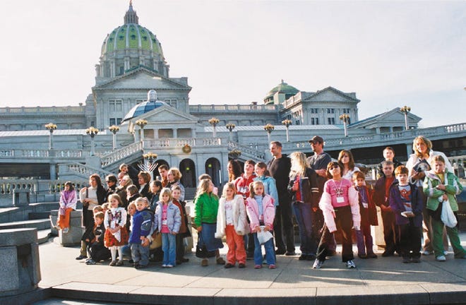 Students from the Polish Supplementary School visit with state Rep. Mario Scavello, R-176 on a field trip to the capitol building in Harrisburg last fall.
