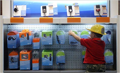 Barrett Lee, 2, looks at cellphone accessories in the AT&T megastore in Houston.