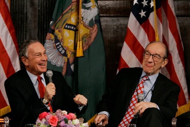 New York Mayor Michael Bloomberg, left, laughs with former Federal Reserve Chairman Alan Greenspan at the conference.