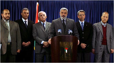 Palestinian coalition officials met reporters Thursday in Gaza. Prime Minister Ismail Haniya, center, was flanked on the right by Mustafa Barghouti, the information minister; and on the left by Azzam al-Ahmed, the deputy prime minister; and Ziad Abu Amr, in dark suit, the foreign minister.