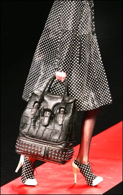 Large hand bags were a popular accessory at recent fashion shows in Paris and Milan.