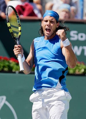 Back on top
 Rafael Nadal celebrates after winning a point over Novak Djokovic in the men's final at the Pacific Life Open tournament Sunday in Indian Wells, Calif. Nadal had gone 12 tournaments without a win until Sunday.