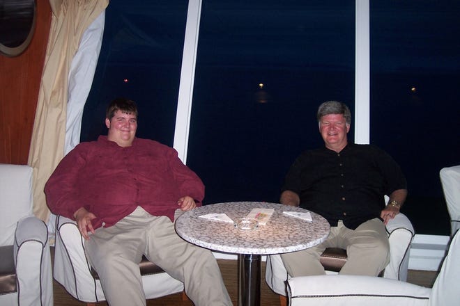 Kyle Maule, left, and his father, Keith, are shown on a trip last summer before Kyle underwent gastric bypass surgery. "I'd walk into a place and people would just sit there and stare,"
Kyle said. "It is a bad feeling all together."