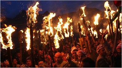 Kurds in the northern Iraqi town of Akri lighted torches Wednesday to celebrate Nowruz, a spring new year holiday with some Zoroastrian links that dates back thousands of years. Iraqis have been fleeing to the Kurdish region in the north to escape the war.