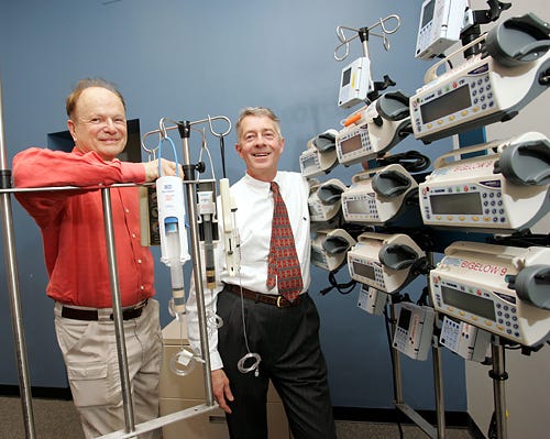 Eric von Hippel of M.I.T., left, and Dr. Nathaniel Sims, with hospital devices Dr. Sims has modified. Mr. von Hippel says users can improve on products.
