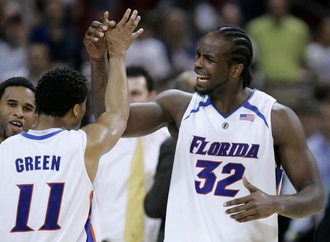 Florida's Taurean Green (11) and Chris Richard (32) react during the second half of the NCAA Midwest Regional final basketball game in St. Louis, Sunday, March 25, 2007. Florida defeated Oregon 85-77 to advance to the Final Four in Atlanta.