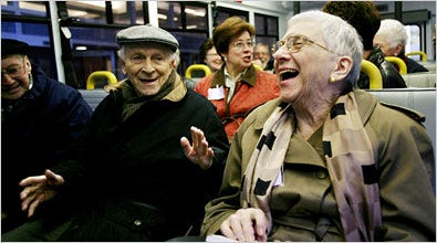 Lawrence Goldstein, center, and Mollie Simon on the Culture Bus, a Chicago Alzheimer's support group.