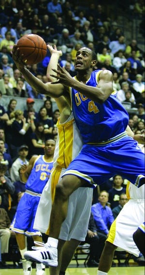 ** FILE ** UCLA's Arron Afflalo scores past California's Ryan Anderson in the first half of a basketball game in Berkeley, Calif., in this Jan. 25, 2007 file photo. Afflalo scored 25 points in UCLA's 62-46 win. Afflalo was selected to The Associated Press 2006-07 All-America college basketball team Monday March 26, 2007. (AP Photo/Marcio Jose Sanchez)