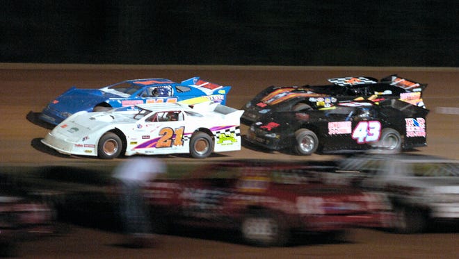 Late Models round the track during Friday's season opener at Oglethorpe Speedway Park.